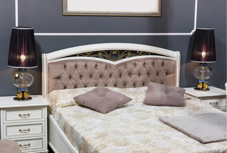 how to make a bed look luxurious - Invest in a Statement Headboard